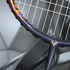 Sleek metallic design of the Victor DriveX 10 Badminton Racket